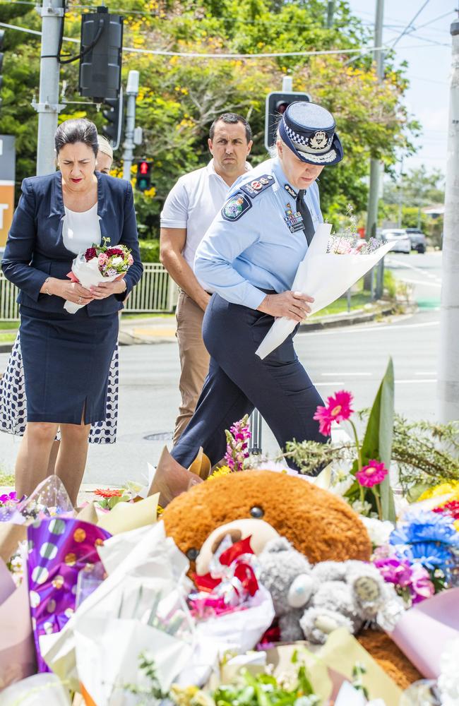 Premier Annastacia Palaszczuk and Queensland Police Service Commissioner Katarina Carroll lay flowers for Kate Leadbetter and Matty Field at the intersection of Vienna and Finucane Roads at Alexandra Hills. Picture: Richard Walker