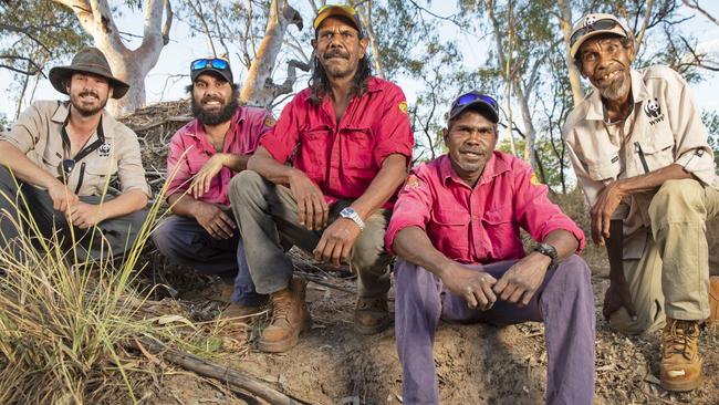 Nick Weigner, left, and Pius Gregory, far right, of the WWF flank Nyaliga rangers Silas Purcell, Thomas Birch and Clayton Victor, who used motion sensor cameras to survey animal life on two former cattle stations on Nyaliga country. Picture: WWF/Nathan Dyer