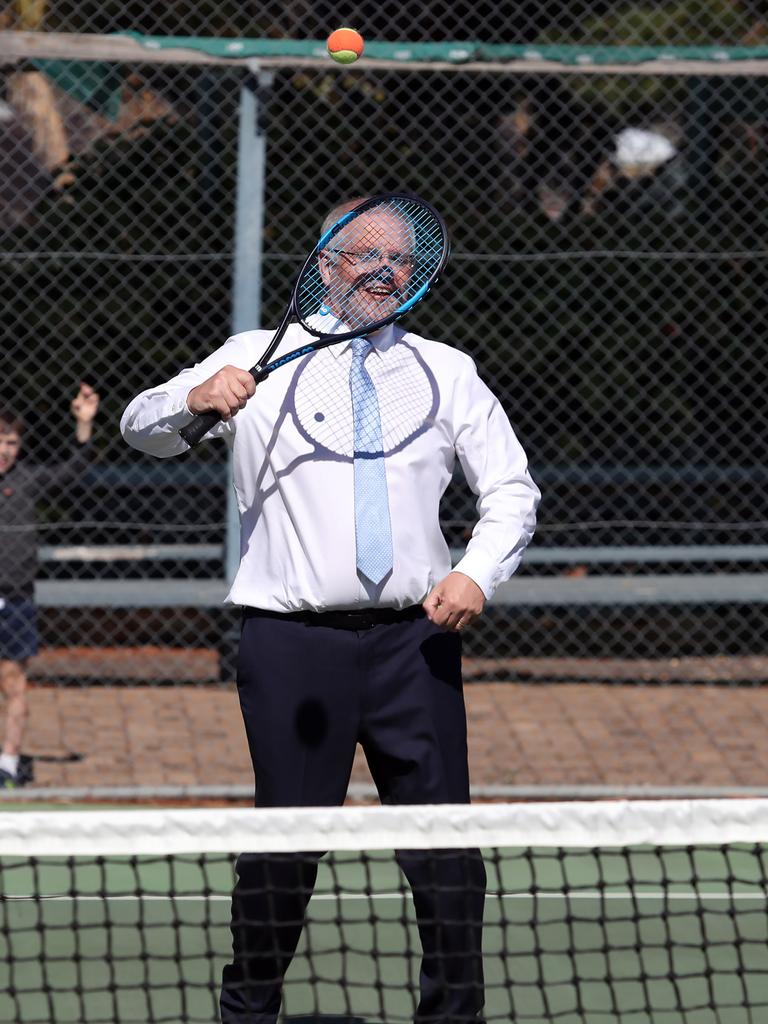 Scott Morrison tries tennis. Picture: Gary Ramage