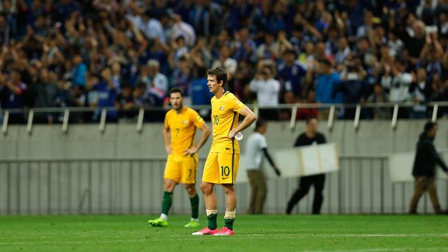 The Socceroos were left dejected after the 2-0 defeat in Japan. Picture: Getty Images