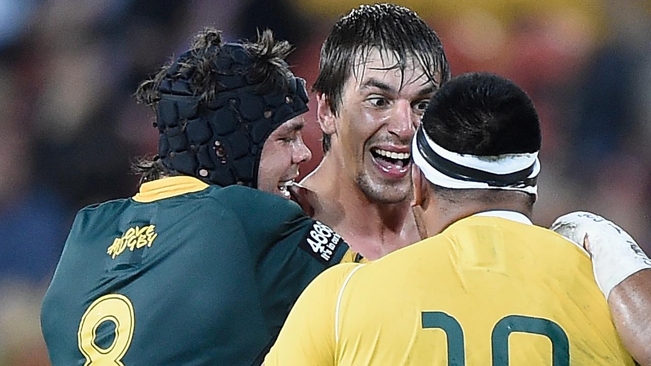 Eben Etzebeth of the Springboks wrestles with Allan Alaalatoa of the Wallabies.