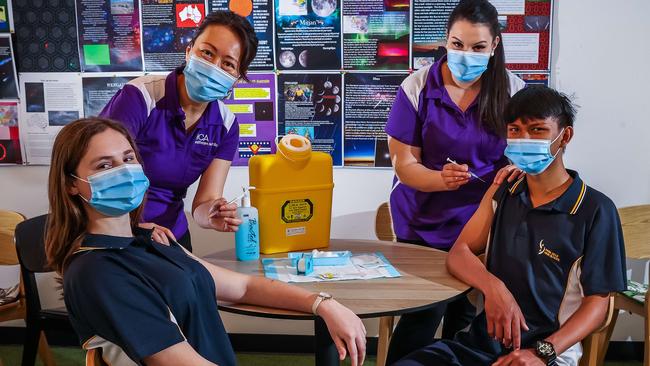 Nurses Mayuko Homma and Jessica Simpson with Para Hills High School Year 10 students Josie and Peerapat, as Covid vaccines are rolled out in schools from Monday. Picture: Tom Huntley