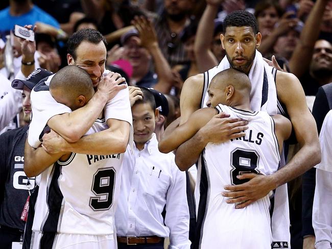 Spurs stars Manu Ginobili (L), Tony Parker (#9), Patty Mills (#8) and Tim Duncan celebrate their NBA championship win.