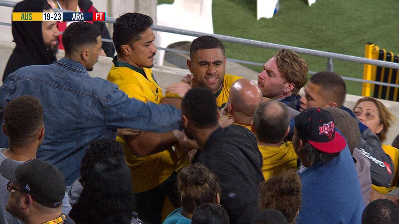 Tui grabs at a fan after being abused following the loss to the Wallabies.
