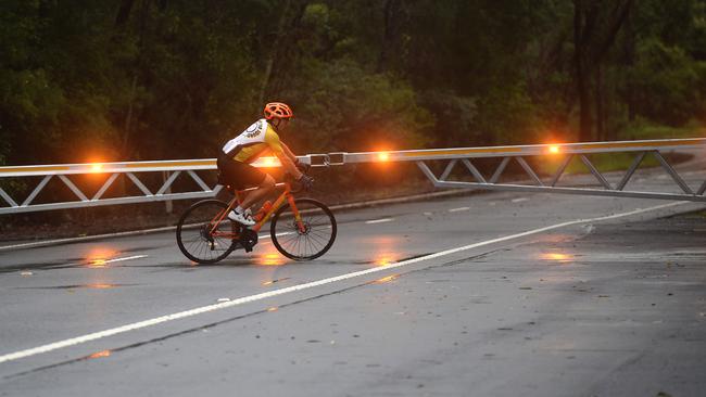 Flooding boomgates block all traffic on Wakehurst Parkway in December last year. Picture: Jeremy Piper