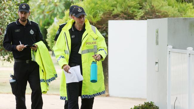 Police doorknock at Nudgee Beach, warning residents of the impending storm and their options. Picture: Annette Dew