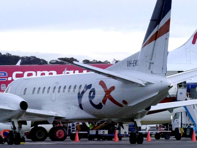 Aircraft (L-R) from regional airline Rex, Virgin and Qantas at terminal at Canberra Airport in Canberra.