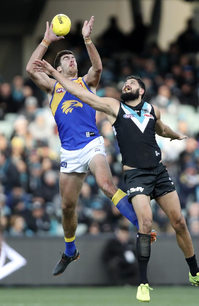 Scott Lycett and Paddy Ryder go head to head earlier this season. They will join forces next season unless West Coast matches Port Adelaide’s offer. Picture Sarah Reed