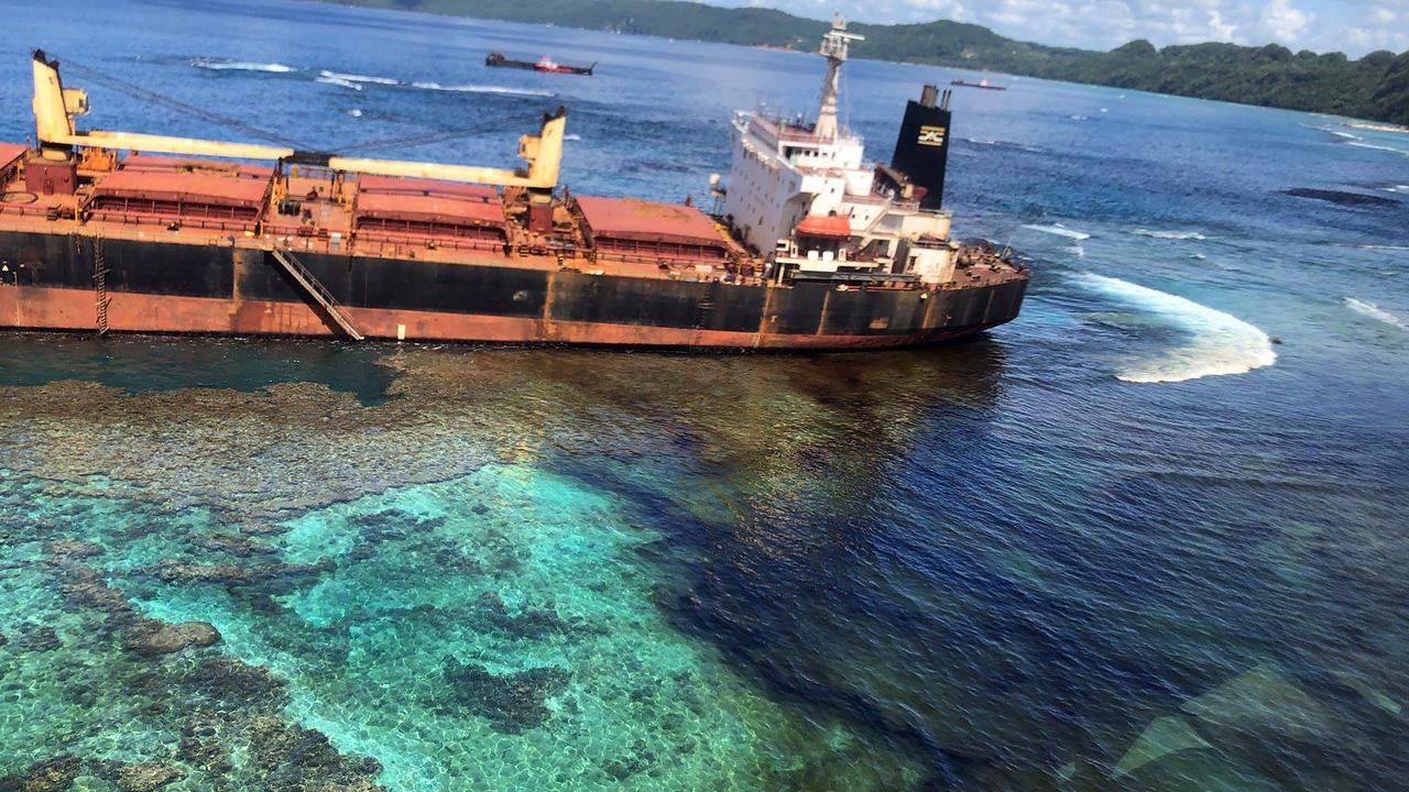 The ship Solomon Trader on the coast of Rennell Island. The ship ran aground and began spilling oil a month ago. Picture: AFL/DFAT