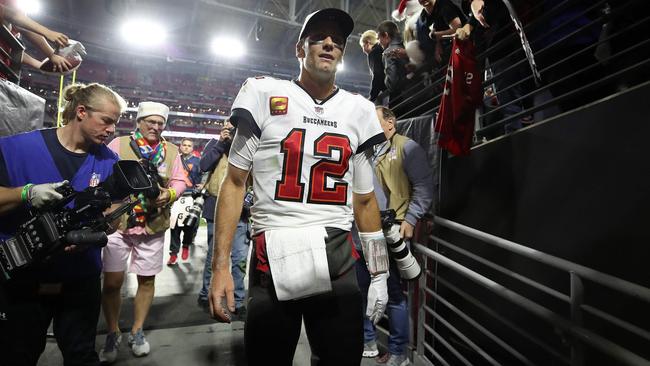 GLENDALE, ARIZONA - DECEMBER 25: Tom Brady #12 of the Tampa Bay Buccaneers walks off the field after the Buccaneers defeated the Arizona Cardinals in overtime to win the game at State Farm Stadium on December 25, 2022 in Glendale, Arizona.   Christian Petersen/Getty Images/AFP (Photo by Christian Petersen / GETTY IMAGES NORTH AMERICA / Getty Images via AFP)