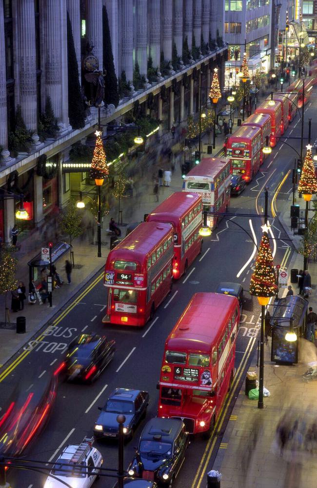 Traffic flowing along Oxford Street in London at Christmas with buses the choice of transport.