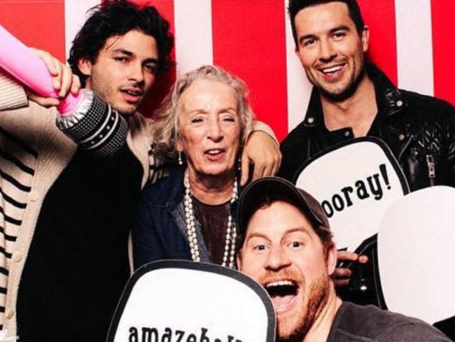 Prince Harry poses with guests while holding an ‘amazeballs’ sign. Picture: Instagram