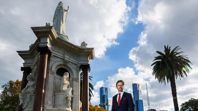 Deputy Lord Mayor of Melbourne Nick Reece at the Queen Victoria statue in Queen Victoria Gardens. He is pushing to get a statue for the suffragette Vida Goldstein. Picture: Aaron Francis