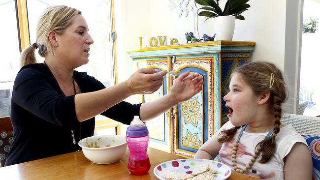 ‘She’s really healthy and well now’: Tasmania-based Nicole Cowles with her daughter Alice, who has a rare genetic condition that medicinal cannabis helps to alleviate.