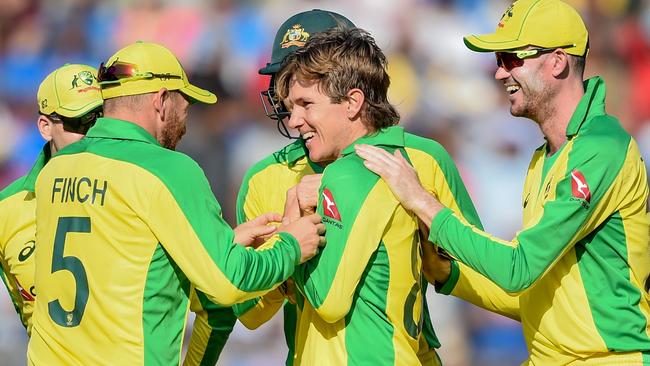 Australia's Adam Zampa celebrates with teammates the dismissal of India's Virat Kohli on the subcontinent. Picture: AFP