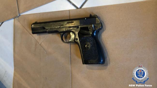 Police found a 9mm pistol and a loaded 9mm pistol magazine in a search of the home. Picture: NSW Police