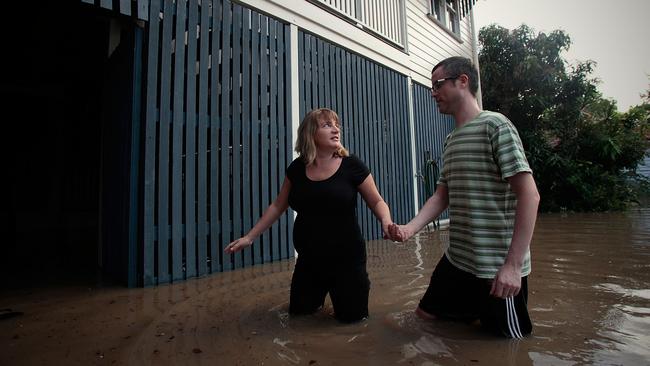 Expectant mother Anna Campbell and her husband Andrew Woodcock survey the backyard of their Milton house on Wednesday 12, 2011.