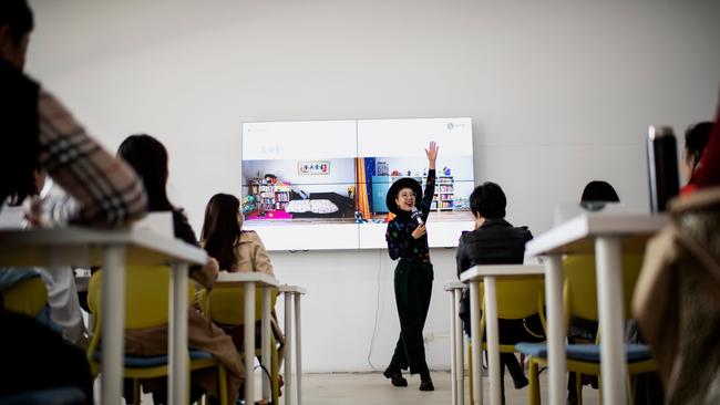 Bian Lichun, founder of the Liucundao Business School, teaches a home organising class in Beijing.