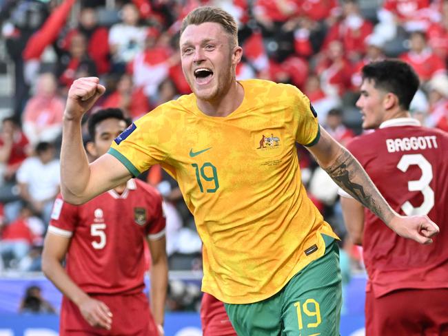 Australia's defender #19 Harry Souttar celebrates scoring his team's fourth goal during the Qatar 2023 AFC Asian Cup football match between Australia and Indonesia at the Jassim bin Hamad Stadium in Doha on January 28, 2024. (Photo by HECTOR RETAMAL / AFP)