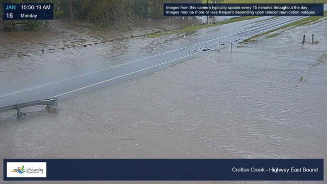 Whitsunday Regional Council's flood cameras show water over the road at Crofton Creek along the Bruce Highway, east bound.