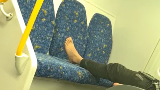 The man had his bare foot on the seat for the entire ride. Image: Kidspot