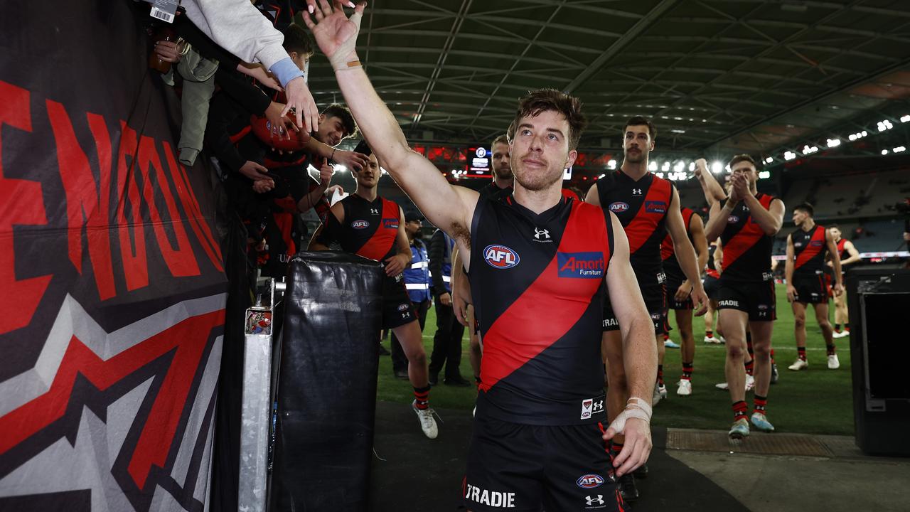 MELBOURNE, AUSTRALIA - JULY 09: Zach Merrett of the Bombers leads the team off the field after winning the round 17 AFL match between Essendon Bombers and Adelaide Crows at Marvel Stadium, on July 09, 2023, in Melbourne, Australia. (Photo by Daniel Pockett/Getty Images)