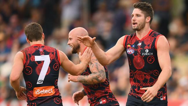 Jesse Hogan of the Demons is congratulated by Jack Viney and Nathan Jones after kicking a goal against the Crows at Traeger Park in Alice Springs. Picture: Quinn Rooney/Getty Images                        <a capiid="da6c89cf2dca1f5fbeb0fd546f48cc67" class="capi-video">'They didn’t even try'</a>