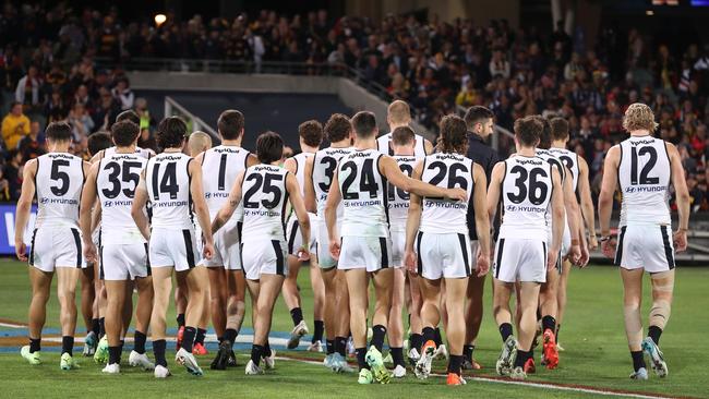 Carlton players walk off after Thursday night’s loss. Picture: Sarah Reed/AFL Photos