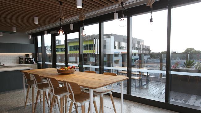 The lunch room spreads inside and out to the balcony. Picture: Alan Barber