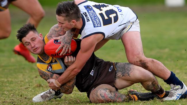 Brayden Burgess is tackled by Zach Molloy. Picture: Andy Brownbill