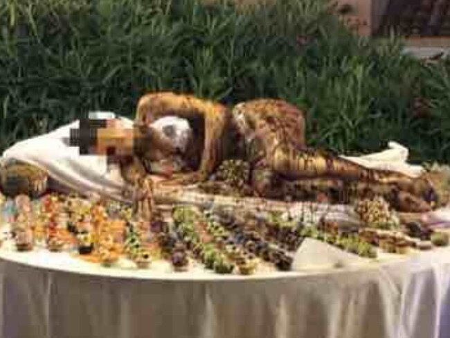 A hotel in Italy has been slammed after a bikini-clad model covered in chocolate was used as the centrepiece of a family buffet.