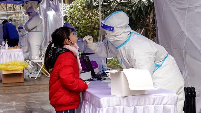 A girl is tested for Covid-19 in Xian on Christmas Day. Picture: AFP