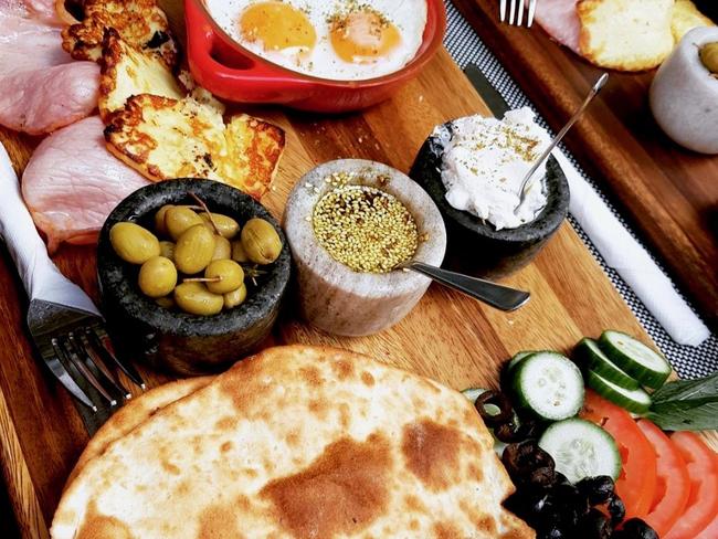 Munoushee on Majors Bay’s Big Breakfast with baked ham, baked eggs, grilled haloumi, freshly baked Lebanese bread with a yoghurt dip, zaatar oil dip, green olives and vegetables. Picture: Facebook