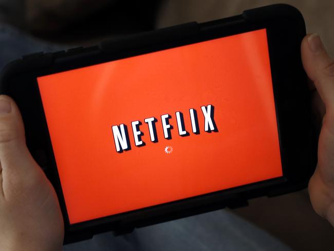 FILE - In this Friday, Jan. 17, 2014, file photo, a person displays Netflix on a tablet in North Andover, Mass. Netflix reports financial results Monday, Oct. 17, 2016. (AP Photo/Elise Amendola, File)