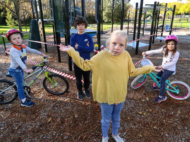 Tom, 5, Manon, 9, Marcus, 9, and Olive, 6 at a closed playground. Picture: Alex Coppel