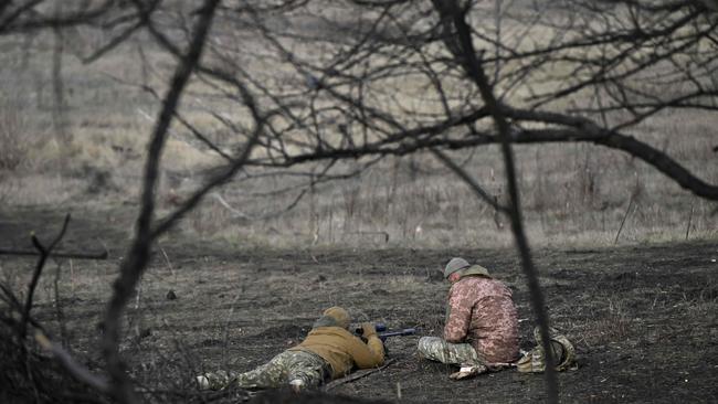 Soldiers of the 59th brigade of Ukrainian Armed Forces conduct a sniper training at an undisclosed location in the Donetsk region on January 22. Picture: AFP