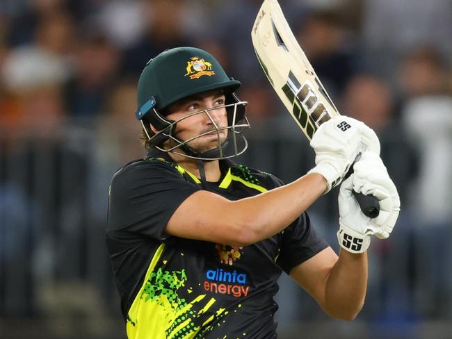 PERTH, AUSTRALIA - OCTOBER 09: Tim David of Australia plays his pull shot during game one of the T20 International series between Australia and England at Optus Stadium on October 09, 2022 in Perth, Australia. (Photo by James Worsfold/Getty Images)