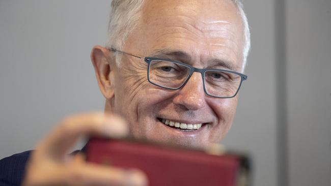 Australian Prime Minister Malcolm Turnbull poses for a selfie at the Seniors Forum at the Sandstone Point Hotel, in Brisbane, Thursday, June 7, 2018. (AAP Image/Glenn Hunt) NO ARCHIVING