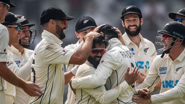 New Zealand's Ajaz Patel (C) celebrates with his teammates after taking his history-making 10th wicket.