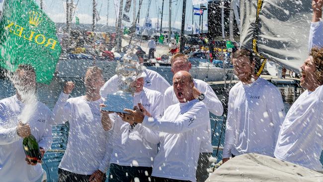 The crew of Tasmanian yacht Alive celebrate after being declared the handicap winner of the 2018 Sydney to Hobart. Picture: AAP/ROLEX/STUDIO BORLENGHI