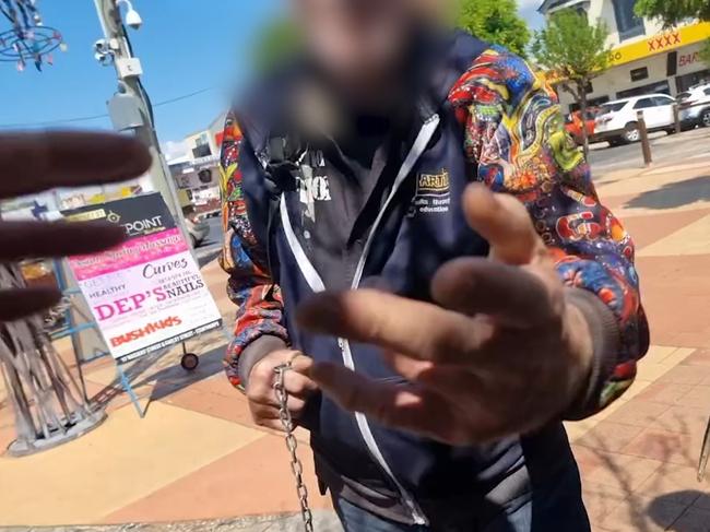 A Yes supporter says 'I'll deck you' before aggressively reaching towards a man (Photo: Facebook)