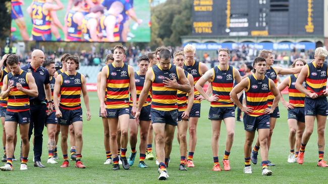 The Crows walk off after Saturday’s loss to the Giants. Picture: Sarah Reed/AFL Photos