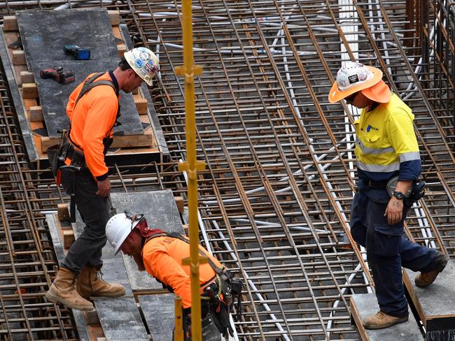 Construction workers are seen on a building site on Charlotte Street in Brisbane, Wednesday, February 21, 2018. Figures released by the Australian Bureau of Statistics showed private sector wages grew by 1.9 per cent in the year to December. (AAP Image/Darren England) NO ARCHIVING