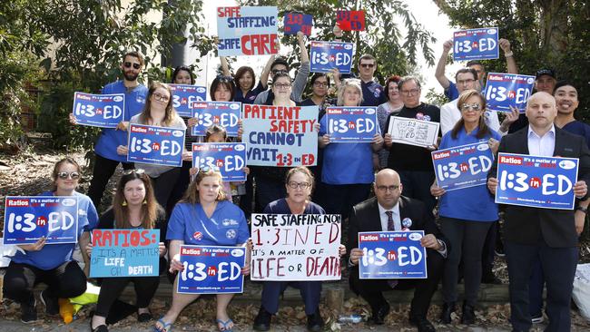 Canterbury Bankstown Mayor Khal Asfour, front right kneeling, and some councillors joined the protest organised by the NSW Nurses and Midwives’ Association at Bankstown-Lidcombe Hospital. Picture: Robert Pozo