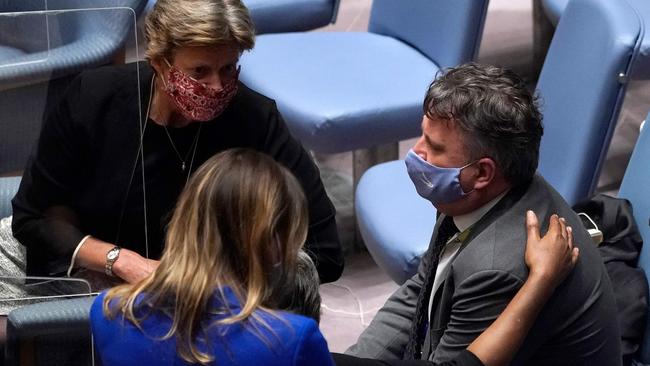 US ambassador to the United Nations (UN) Linda Thomas-Greenfield (C partially hidden) comforts Ukraine Permanent Representative to the United Nations Sergiy Kyslytsya (R) after an emergency meeting of the UN Security Council on Ukraine in New York on February 23.