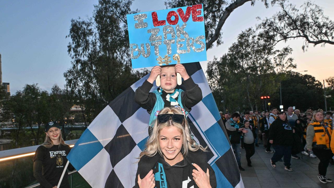 SEPTEMBER 13, 2024: Hayley Perrett and son Levi 3yo heading to the Port v Hawthorn semi final at Adelaide Oval. Picture: Brenton Edwards