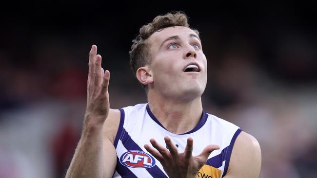 MELBOURNE, AUSTRALIA - AUGUST 04: Tom Emmett of the Dockers marks the ball during the round 21 AFL match between Essendon Bombers and Fremantle Dockers at Melbourne Cricket Ground, on August 04, 2024, in Melbourne, Australia. (Photo by Martin Keep/AFL Photos/via Getty Images)