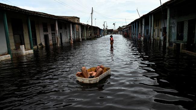 Flooding from Hurricane Helene reportedly caused dozens of EVs, golf carts, mobile wheelchairs and scooters to catch fire. Picture: Yamil Lage/AFP