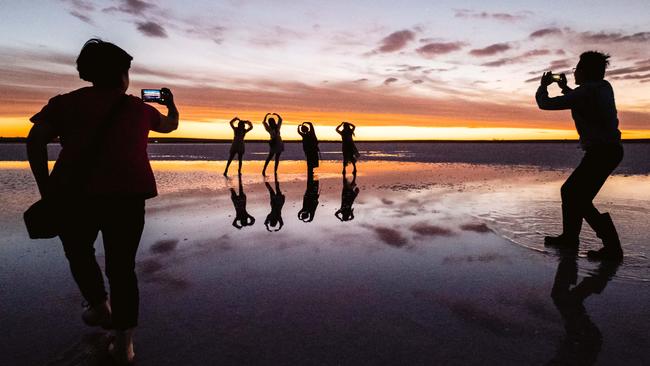 Chinese tourists at sunset on Lake Tyrrell, Sea Lake, Victoria. Picture: Jaime Murcia.