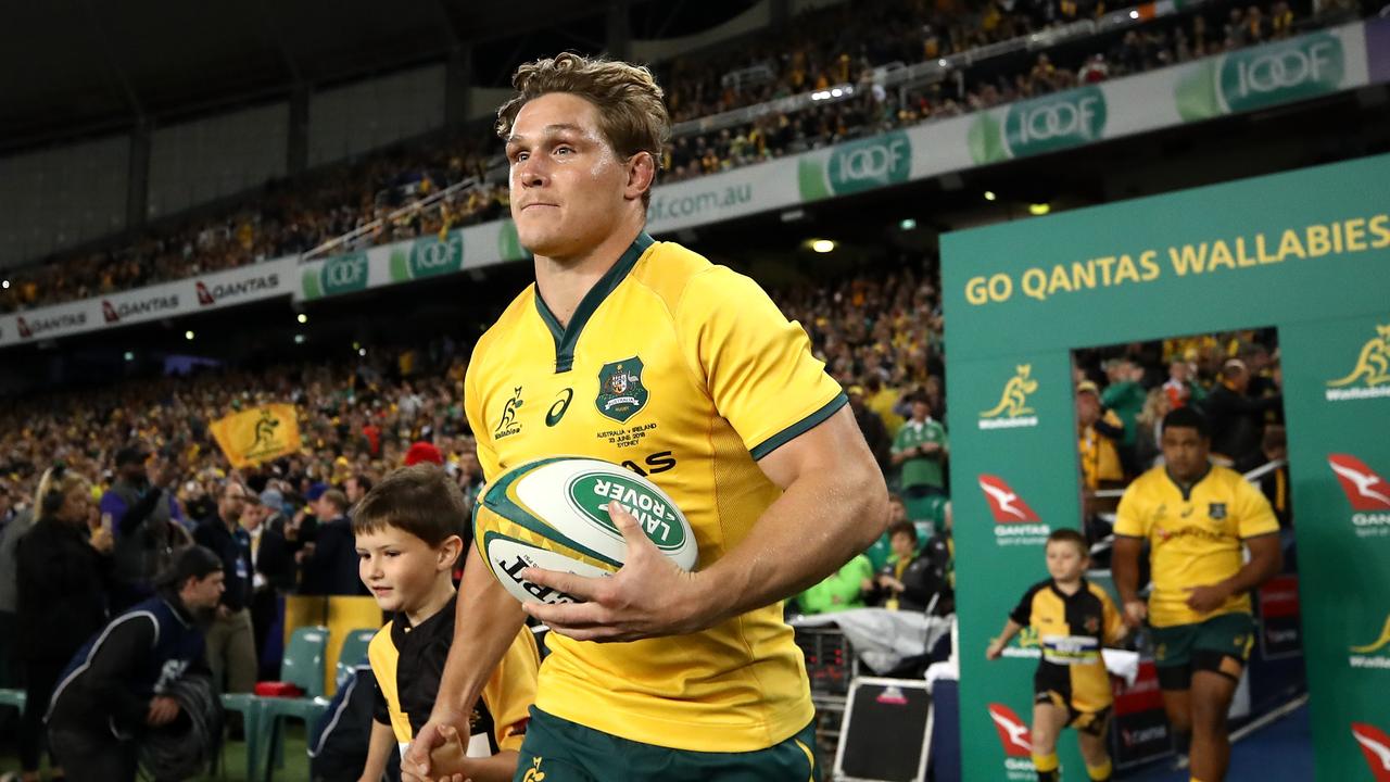 Michael Hooper of the Wallabies leads his team onto the field.